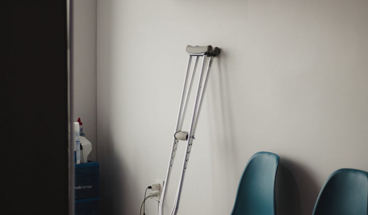 Crutches against the wall of an empty waiting room