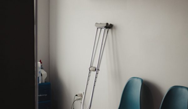 Crutches against the wall of an empty waiting room