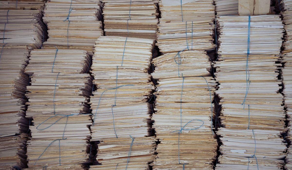 High stacks of bound paper bundles