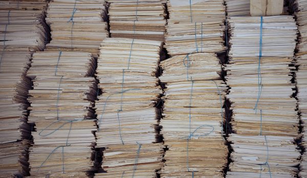 High stacks of bound paper bundles