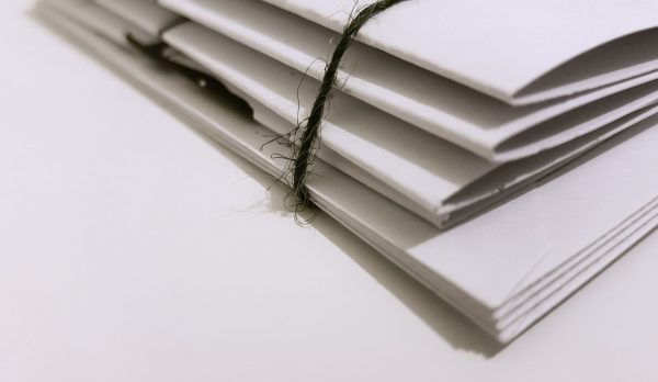 A pile of white envelopes tied with string