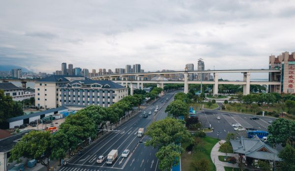 Aerial view of a cityscape with an elevated highway
