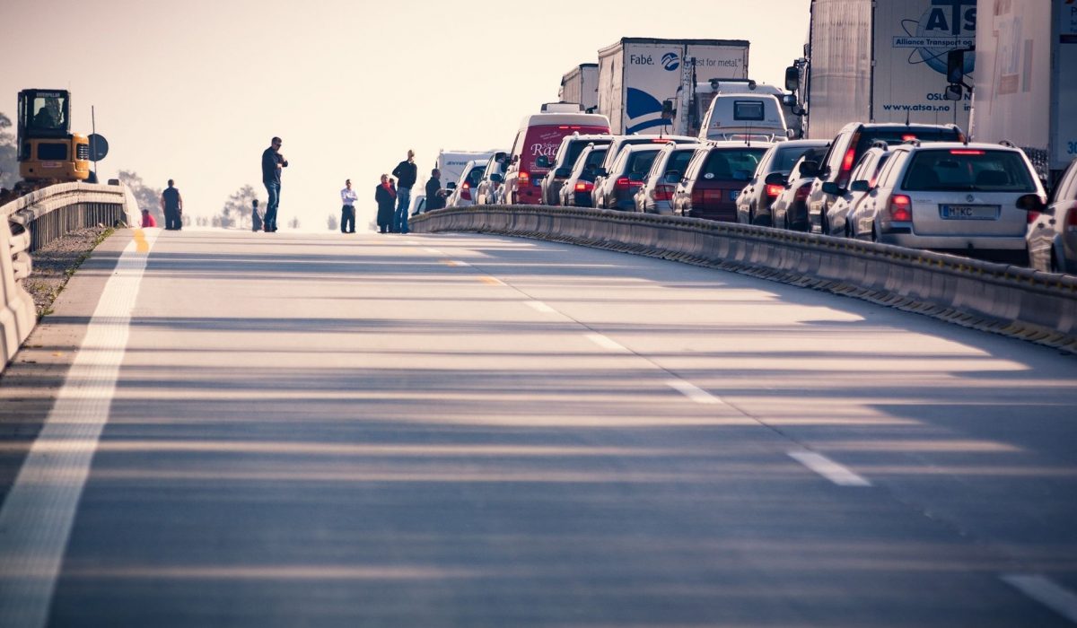 A congested motorway with cars and lorries at a standstill