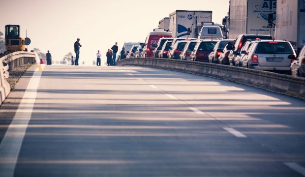 A congested motorway with cars and lorries at a standstill