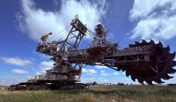 A massive bucket-wheel excavator in open country