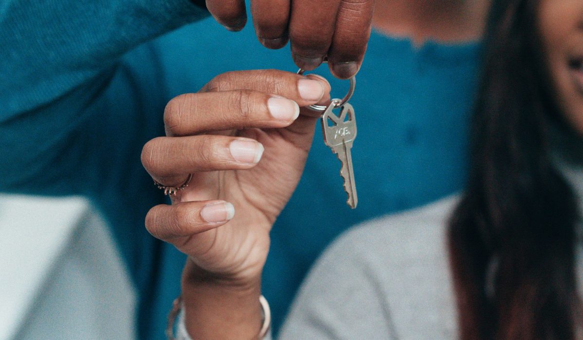 A couple holding a house key
