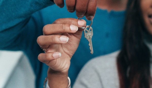 A couple holding a house key