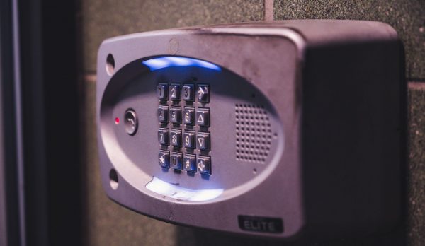 An illuminated keypad on a wall